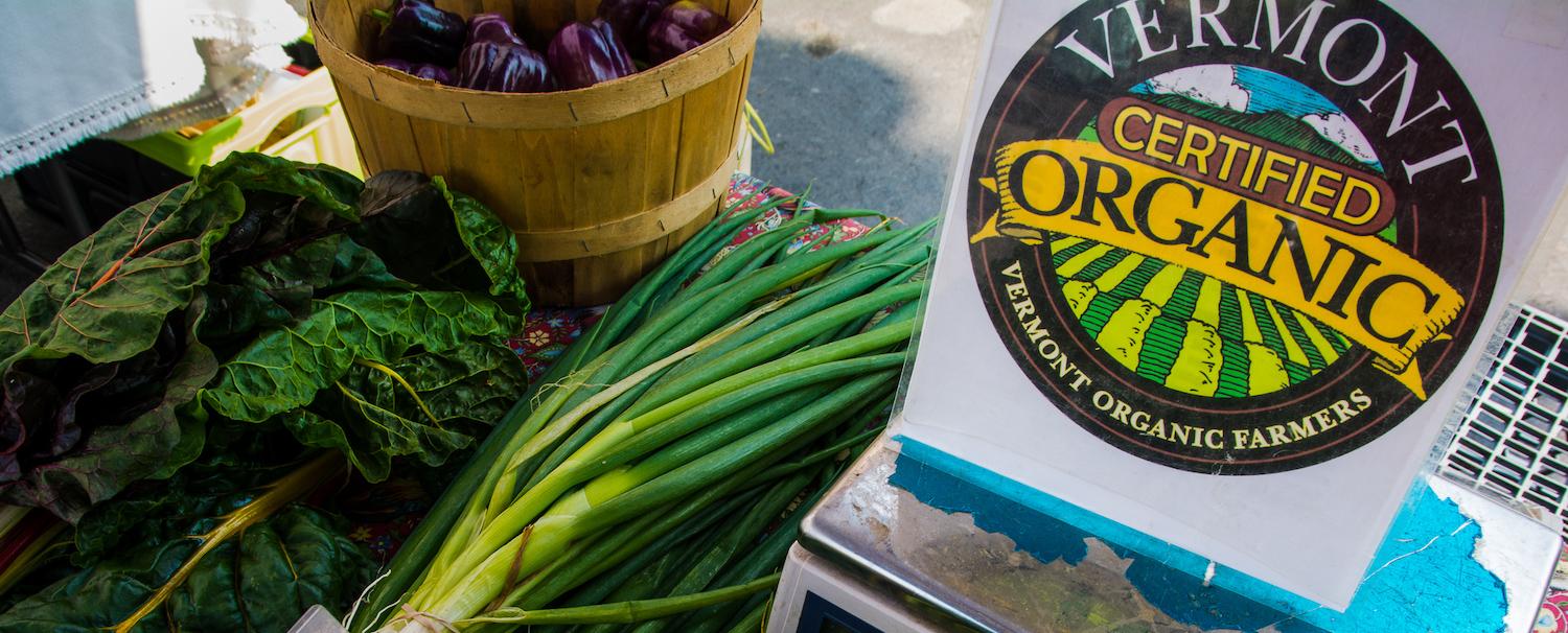 Vegetables next to a sign of the VOF seal